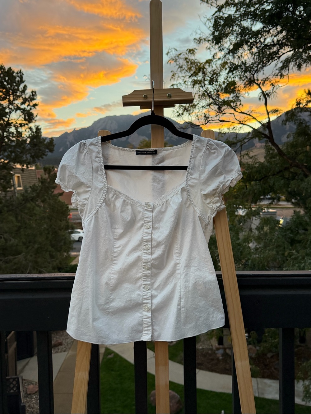 Brandy Melville white button up blouse with ruffle details